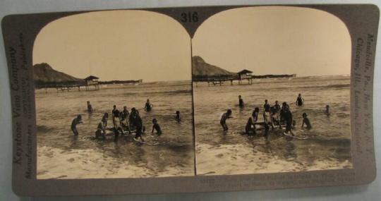 Boys with Surf Boards Indulging in Their Famous Native Sport on Beach at Waikiki, near Honolulu, Hawaii