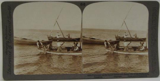 Fishermen on the Sea of Galilee and distant hills of the Gadarenes, Palestine.