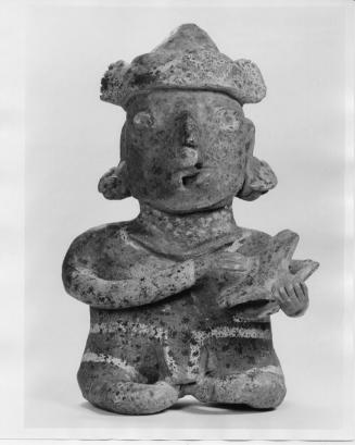 Seated Figure with Turtle Shell