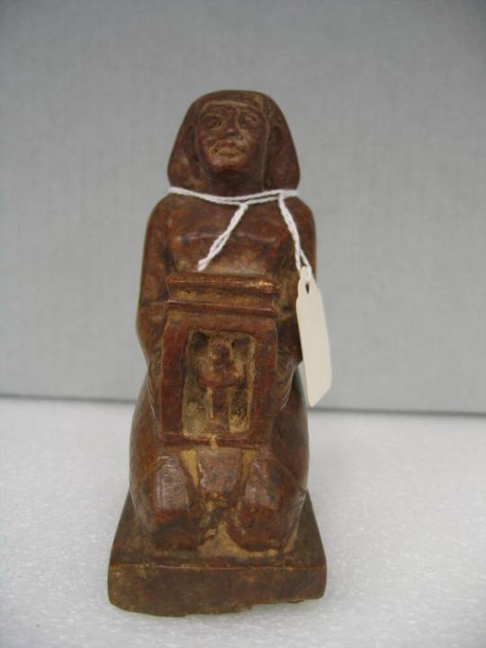 Kneeling Figure Holding Casket