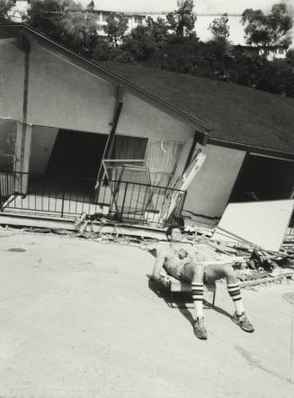 Off-duty Cop Guarding a House which Slid Down a Hill, Los Angeles, California