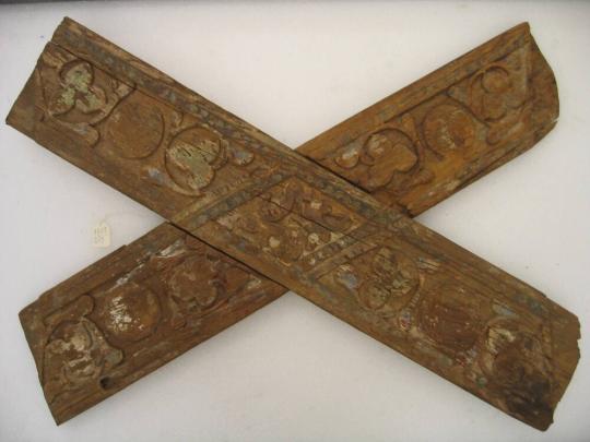 Crossboard carved with ornamental and floral designs, probably from ceiling paneling