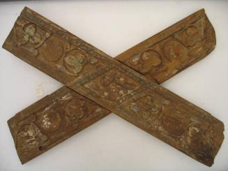 Crossboard carved with ornamental and floral designs, probably from ceiling paneling