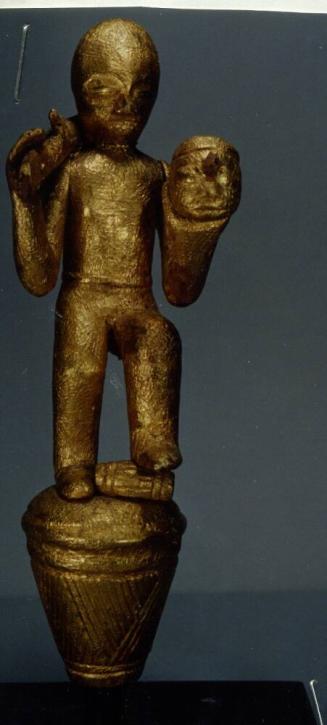 Linguist Staff Finial Representing a Warrior with a Rifle and Trophy Head