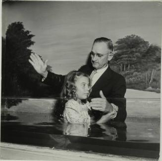 Baptist church, Child about to be immersed in water during baptismal ceremony, Tomball, Texas