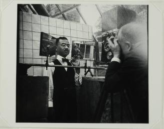 Frank Gilbreth filming subject with profiling mirrors