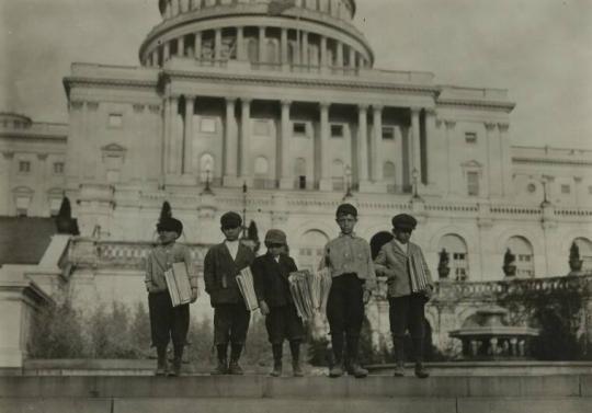 Group of newsies selling on Capitol Steps.