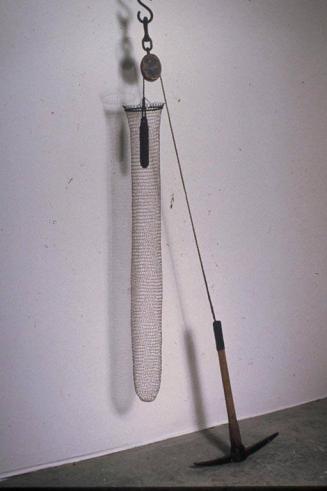 Net:  Elongated Tube with Pick Mattock