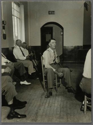 Southeastern U. S., Men Seated in Building
