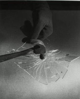 Hammer Breaks Glass Plate