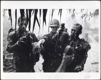 Soldiers Filling their Canteens with Rainwater, South Vietnam